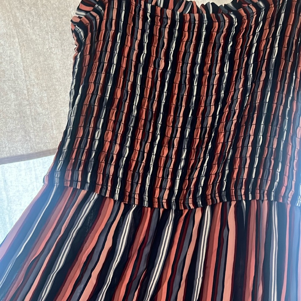 Striped dress with a ruffle bottom and a ribbed top.